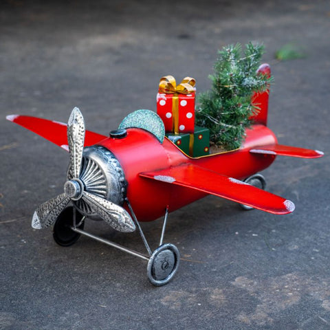 Small Red Airplane with Lighted Christmas Tree and Gifts